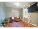 Cozy living room with wood floors, a brown sofa, and a stylish area rug at 124 Vintage Woods Ct, Shelby, NC 28150