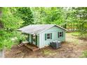 Back of the house and surrounding trees at 24 19Th Nw St, Hickory, NC 28601