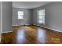 This living room features beautiful hardwood floors, natural light, and fresh paint throughout the space at 24 19Th Nw St, Hickory, NC 28601