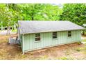 This home features a side view with a neutral color palette and a durable roof at 24 19Th Nw St, Hickory, NC 28601