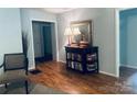 Inviting foyer with elegant table, lamps, and mirror with doorways leading to other rooms at 2405 Forrestbrook Dr, Kannapolis, NC 28083