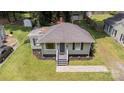 Inviting single-story home with well-maintained lawn and landscaping at 2819 Georgia Ave, Charlotte, NC 28205