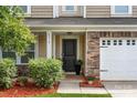 Inviting front entrance with stylish stone accents and a well-manicured garden bed at 6510 Nathan Dr # 78, Charlotte, NC 28269