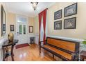 Welcoming foyer featuring hardwood floors and elegant decorative details at 9210 Ginhouse Ln, Charlotte, NC 28277