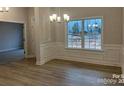 Elegant dining room featuring hardwood floors, chandelier and decorative wall trim at 1130 Gardenia Dr # 7, Mt Ulla, NC 28125
