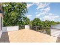 Open-air deck provides stunning views of the surrounding trees and neighborhood at 11938 Fiddlers Roof Ln, Charlotte, NC 28277