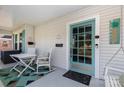 Cozy front porch features a rocking chair, seating area, and bright glass front door at 132 N Confederate Ave, Rock Hill, SC 29730