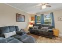 Comfortable living room with plush seating, a ceiling fan, and natural light at 1425 3Rd Street Ne Pl # 9-10, Hickory, NC 28601
