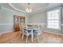 Dining area features a round table, stylish chairs, and a traditional china cabinet at 14727 Brannock Hills Dr, Charlotte, NC 28278