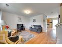 Inviting living room with hardwood floors, comfortable seating, and plenty of natural light at 1583 Cold Creek Pl, Huntersville, NC 28078