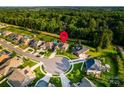 Aerial view of a home in a suburban neighborhood, showcasing its location within a cul-de-sac at 159 Holly Ridge Dr, Mooresville, NC 28115