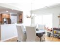 Bright dining area with views into the kitchen, featuring a round table and comfortable seating at 16142 Commodore Dr, Lancaster, SC 29720