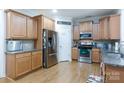 Spacious kitchen featuring stainless steel appliances, ample counter space, and wooden cabinets at 16142 Commodore Dr, Lancaster, SC 29720