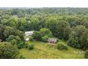 Aerial shot of a wooded homesite with a storage building, set amid natural surroundings at 168 Pleasant Creek Dr, Cleveland, NC 27013