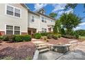 Two-story townhouse with inviting entrance and landscaped garden at 18137 Amberwood Glen Dr, Cornelius, NC 28031
