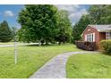 The front yard features a stone walkway that leads to the house and a lamp post at 205 Hillcrest Ave, Rock Hill, SC 29732