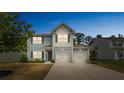 Beautiful two-story home featuring a two-car garage, set against a clear evening sky at 3107 Riker St, Clover, SC 29710