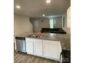 Kitchen area features granite countertops, stainless steel appliances, and an eat-in bar at 323 J C Dellinger Rd, Cherryville, NC 28021