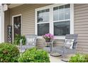 Cozy front porch featuring rocking chairs and decorative plants, perfect for relaxing at 3951 Tersk Dr, Midland, NC 28107