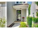 Charming front entry of home with manicured landscaping and welcoming door at 5228 Tomsie Efird Ln, Charlotte, NC 28269
