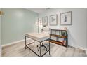 Comfortable home office featuring a light wood desk and decorative artwork at 5228 Tomsie Efird Ln, Charlotte, NC 28269