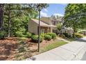 This home has a beautifully landscaped yard with healthy green lawn, mature trees, and a well maintained sidewalk at 7121 Bidford Ct, Indian Land, SC 29707