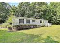Well-maintained home featuring neat landscaping, white siding, and dark shutters, offering comfortable living at 1310 Glasscock Rd, Rock Hill, SC 29730