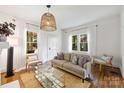 Bright living room with natural light, hardwood floors, and neutral decor at 1417 The Plz, Charlotte, NC 28205