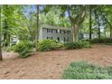 Beautiful two-story home with mature trees and lush landscaping at 1517 E Barden Rd, Charlotte, NC 28226
