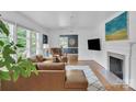 Bright living room featuring hardwood floors, modern decor, and ample natural light at 1619 Flynnwood Dr, Charlotte, NC 28205