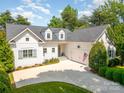 Charming home with a well-manicured lawn and a classic exterior, complete with an attached garage at 17719 Springwinds Dr, Cornelius, NC 28031