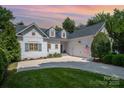 Charming home with a well-manicured lawn and a classic exterior, complete with an attached garage at 17719 Springwinds Dr, Cornelius, NC 28031