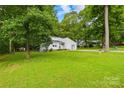 This property boasts a beautiful lawn and mature trees, creating a private and serene setting at 221 Reliance Rd, Kings Mountain, NC 28086