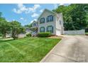 Suburban two-story home with a well-maintained lawn and a driveway leading to an attached garage at 2908 Barnard Castle Ln, Matthews, NC 28104