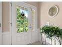 Bright entryway featuring a glass-paneled front door offering a view of the lush garden at 44409 Oriole Dr # 200, Indian Land, SC 29707