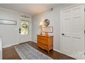Inviting entryway featuring a decorative door, wooden dresser, and stylish decor at 524 Heritage Vw, Indian Trail, NC 28079