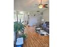 Spacious living area with hardwood floors, lots of light, and comfortable seating at 6902 Vernon Wood Ln, Charlotte, NC 28262