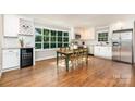 Eat-in kitchen features stainless appliances, granite countertops, and a large window for natural light at 6935 Woodstock Dr, Charlotte, NC 28210