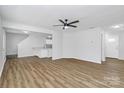 Spacious living room with luxury vinyl plank flooring, modern ceiling fan and recessed lighting creates a cozy atmosphere at 7214 Fox Point Dr, Charlotte, NC 28269