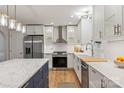Modern kitchen features stainless steel appliances, a large island, and ample counter space at 7810 Leisure Ln, Huntersville, NC 28078