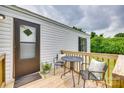 Inviting front porch featuring a cozy seating area with chairs and a table perfect for relaxing outdoors at 976 Neely Store Rd, Rock Hill, SC 29730