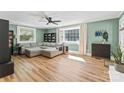 Comfortable living room showcasing wood flooring, green walls, and a large window at 1072 5Th Ne St, Hickory, NC 28601