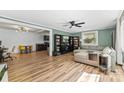 Cozy living room featuring wood flooring, a ceiling fan, and plenty of natural light at 1072 5Th Ne St, Hickory, NC 28601