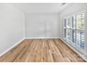 A versatile room with wood floors and great light is an open canvas for new owners at 1090 Mclaren Dr, Belmont, NC 28012