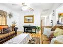 Cozy living room with hardwood floors, ceiling fan, stylish decor and plenty of natural light at 1116 Crestview Dr, Salisbury, NC 28146