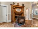 Close up on the fireplace featuring detailed wood trim and a brick hearth at 1282 W Highway 27 Hwy, Lincolnton, NC 28092