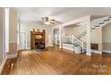 Spacious living room featuring hardwood floors, a fireplace, and staircase at 1282 W Highway 27 Hwy, Lincolnton, NC 28092