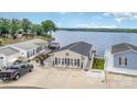 Charming lake house with a spacious driveway, a welcoming porch, and beautiful waterfront views at 141 Badin Lake Cir, New London, NC 28127