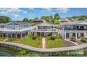 Beautiful waterfront home with a spacious deck, well-maintained landscaping, and stunning lake views at 141 Badin Lake Cir, New London, NC 28127