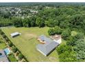 Expansive property featuring a modern home, large yard, swimming pool, and detached garage at 15020 Ranson Rd, Huntersville, NC 28078